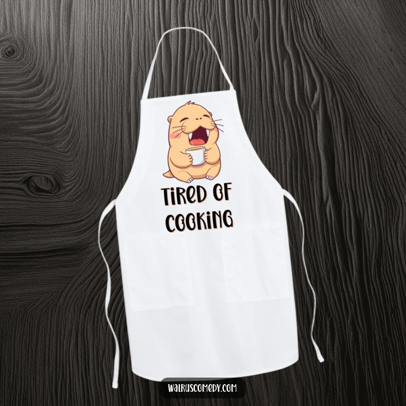 Funny walrus apron showing a tired walrus yawning widely with a tiny teacup, a humorous apron for coffee lovers.