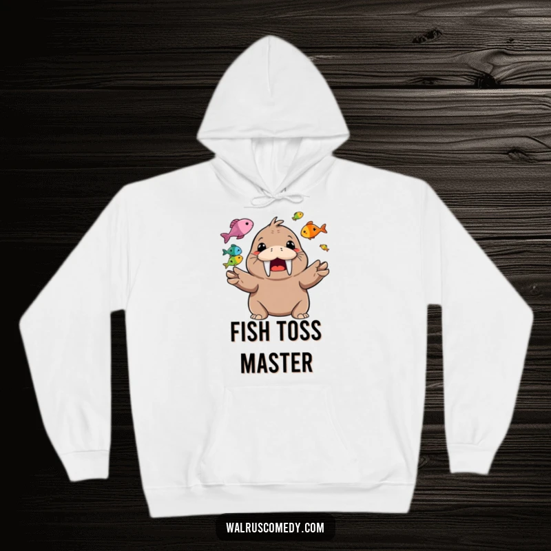 Funny Hoodie featuring a happy walrus character gleefully juggling colorful fish, showing off its grin.