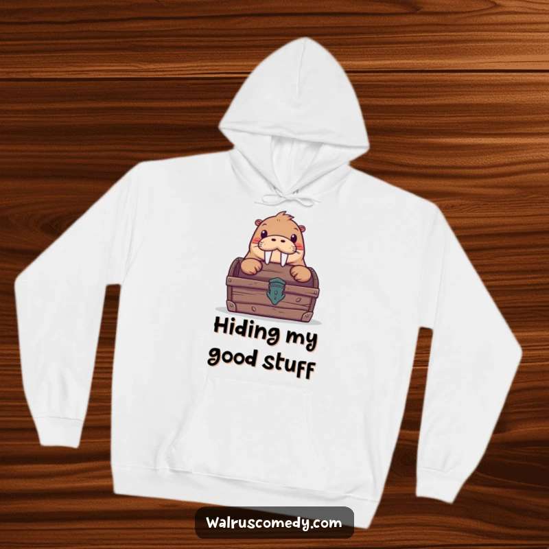 Funny hoodie depicting a curious walrus peeking from behind a treasure chest, offering warmth and a hint of humorous intrigue.