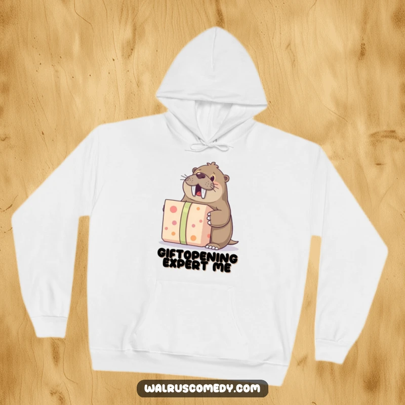 Funny hoodie featuring a walrus character enthusiastically unwrapping a large gift, perfect for staying warm and humorous during celebrations.