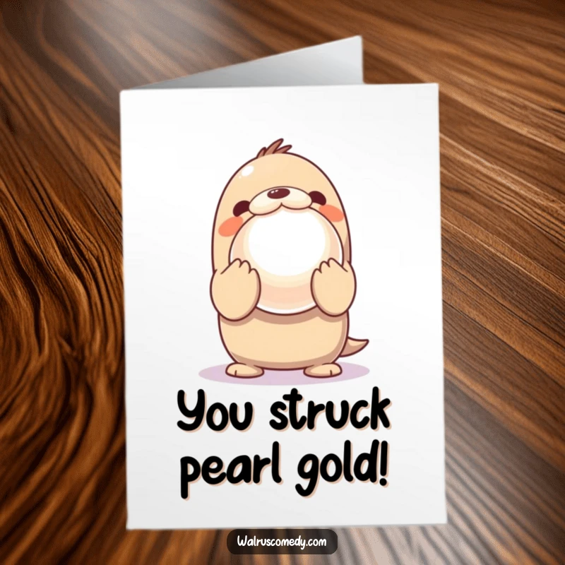 Funny Free Printable Kawaii Walrus Congratulations Card of an excited walrus proudly presenting a giant, shiny pearl.