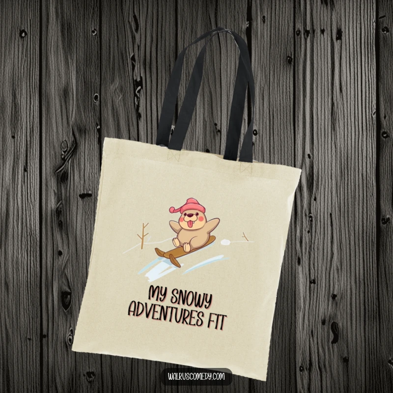Funny tote bag showcasing a walrus character joyfully sliding down a snowy slope, ideal for humorous winter transport.